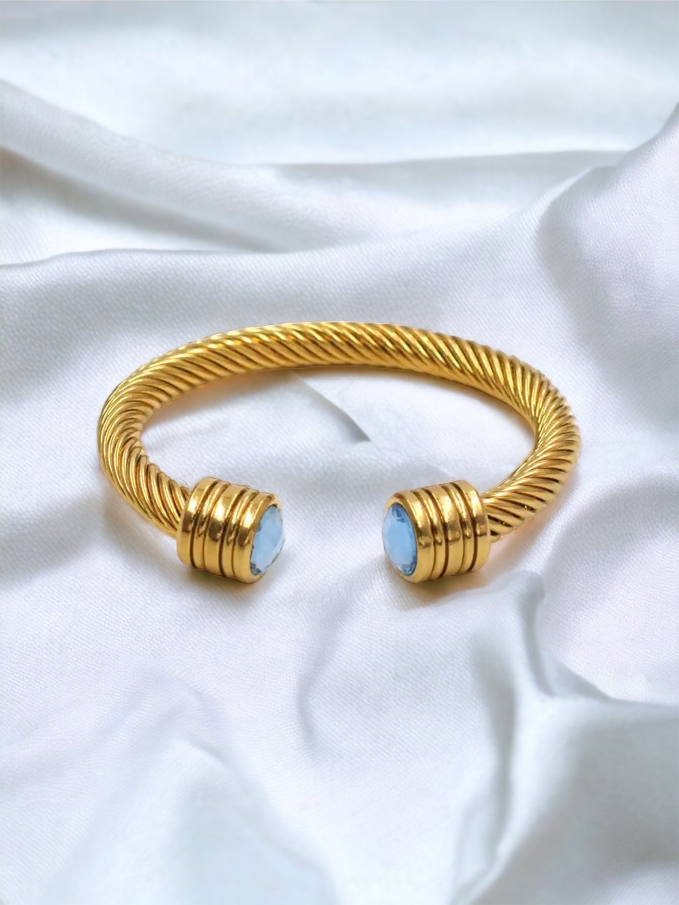 GOLD TWISTED BANGLE - BLUE STONE