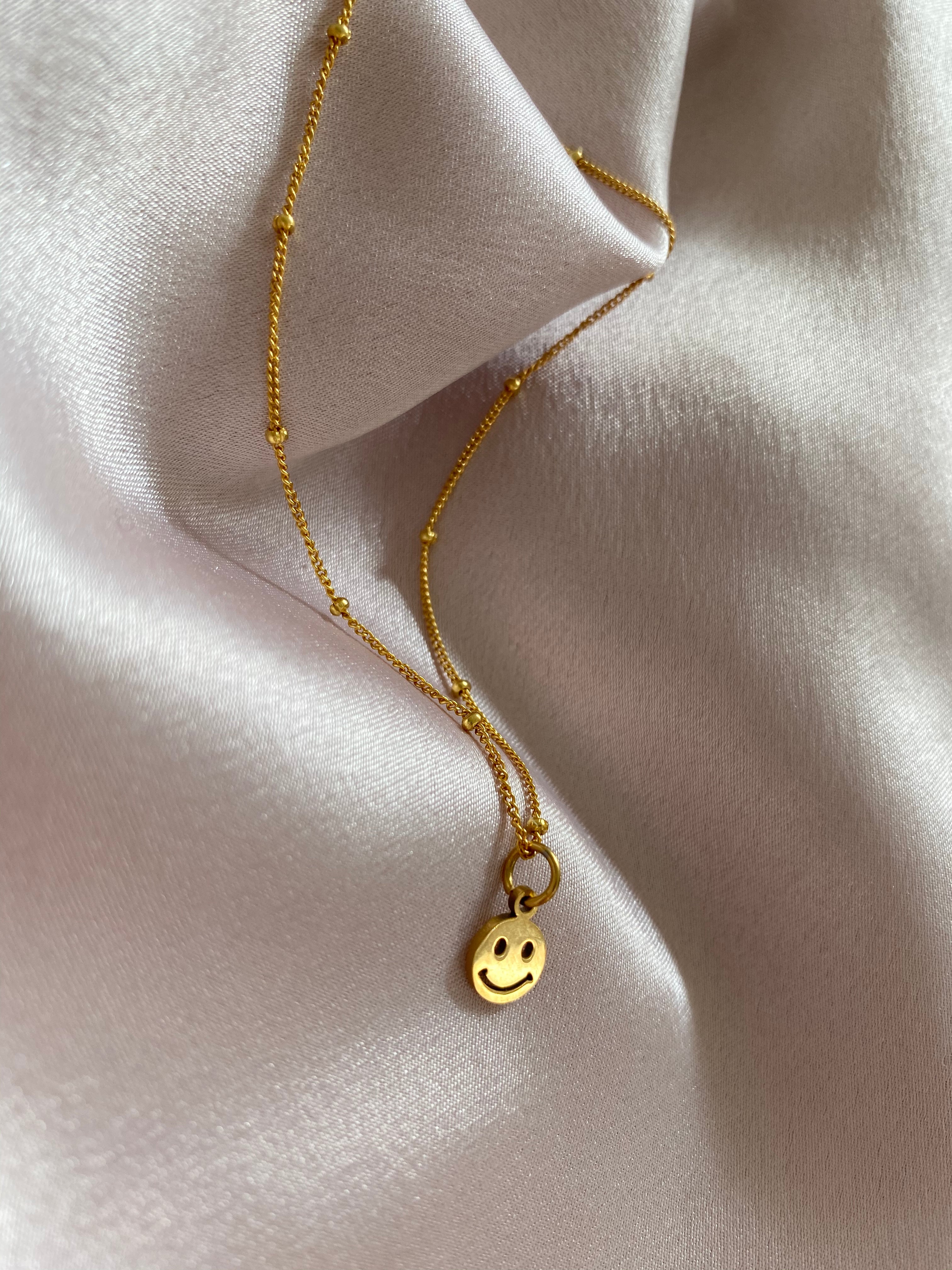 TINY SMILEY NECKLACE