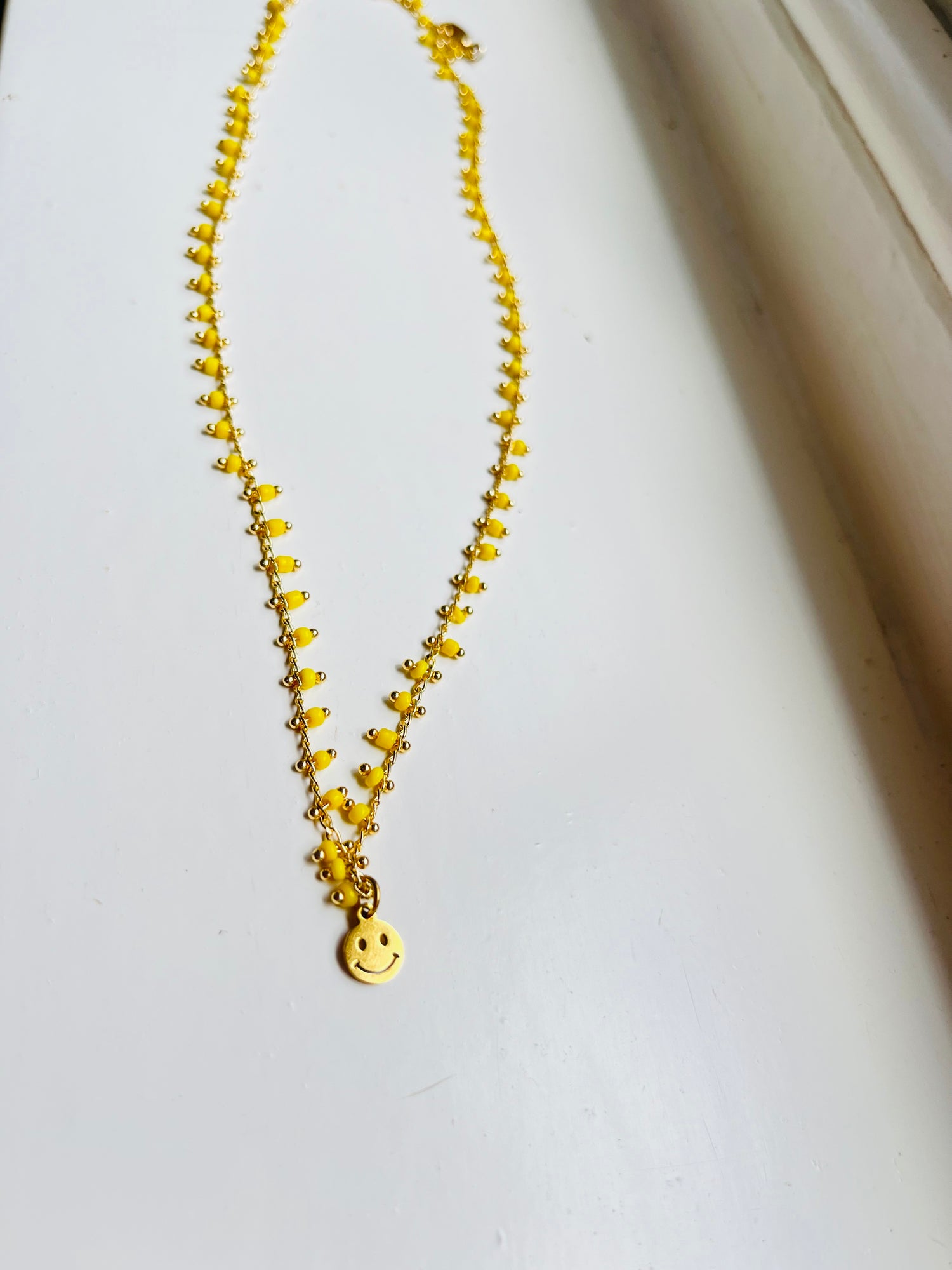 SPREAD SOME SUNSHINE TINY SMILEY NECKLACE