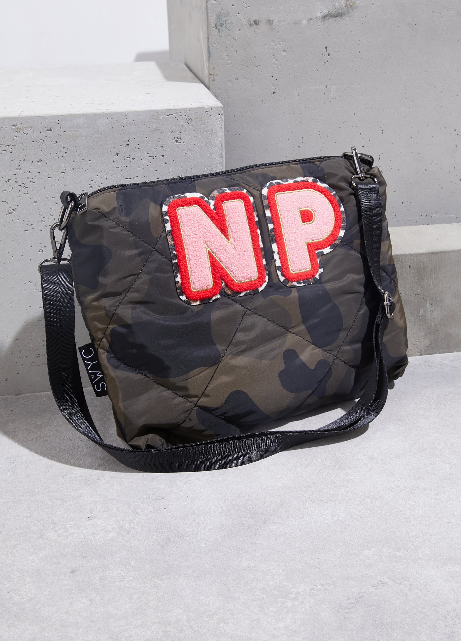 Camo print quilted messenger bag