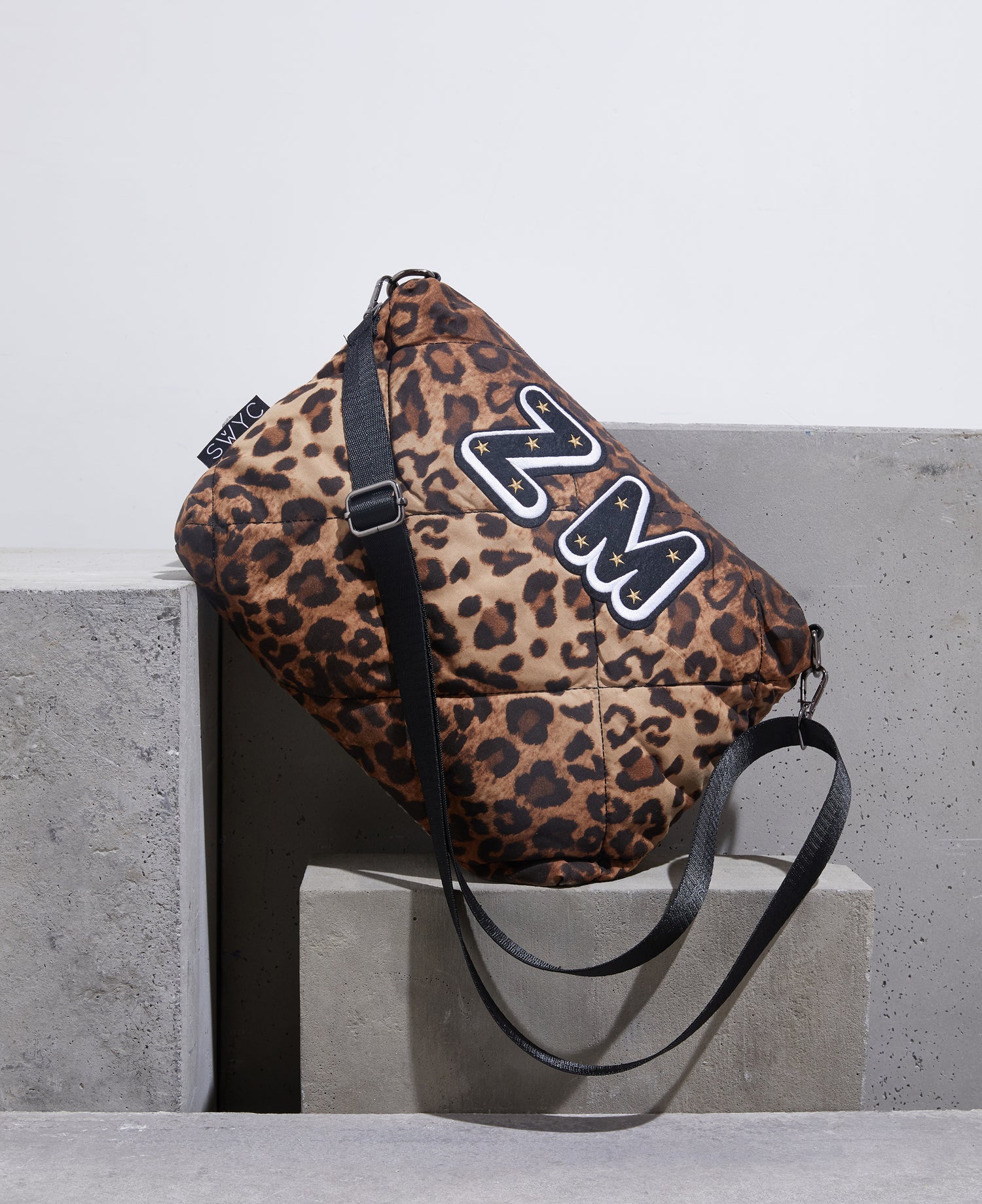 Leopard print quilted messenger bag